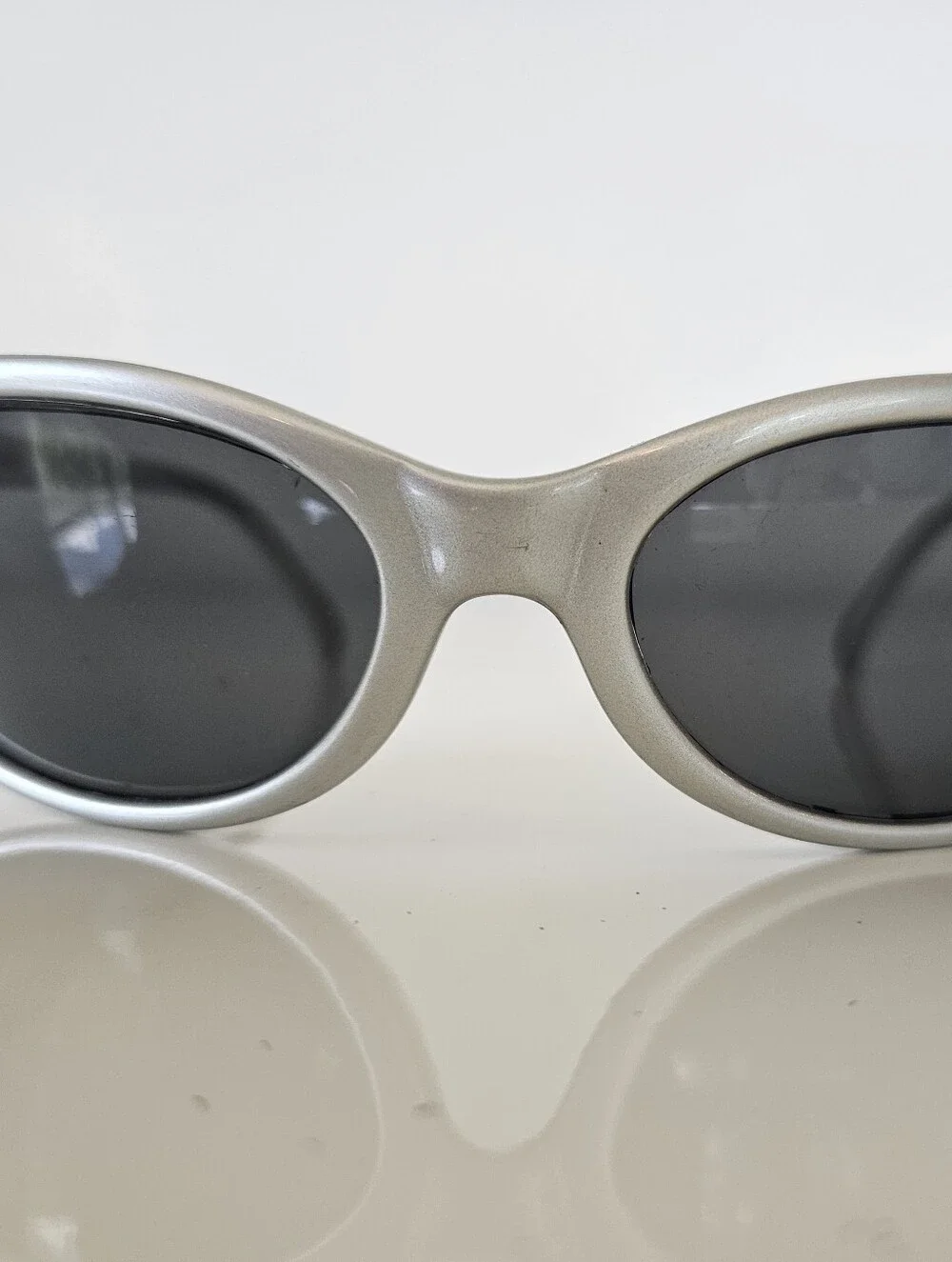 Vuarnet Silver Oval Sunglasses with Dark Lenses